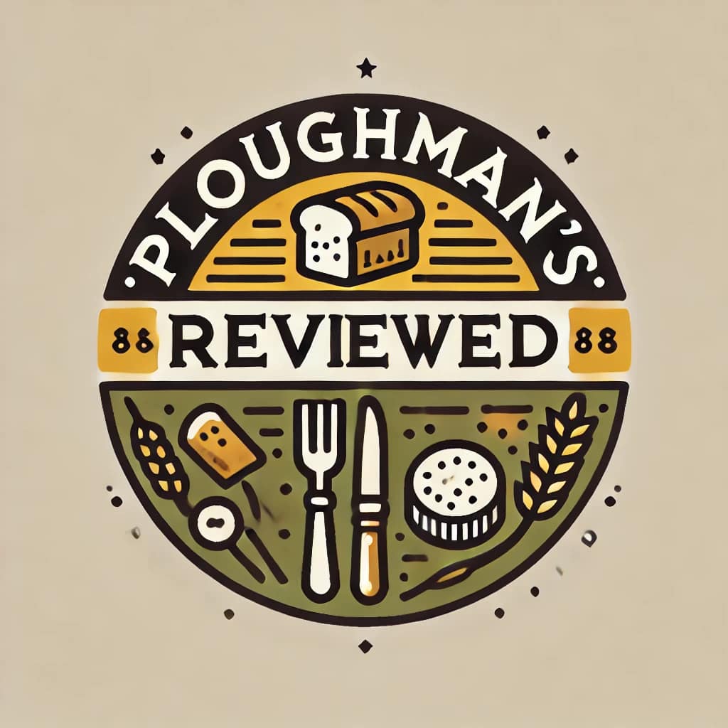 Logo for 'Ploughman's LunchReviewed' featuring a stylized design with bread, a beer mug, fork, knife, cheese, and wheat, all arranged in a circular emblem.